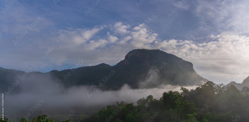 Scenic early morning mountain landscape panorama with low clouds in Chiang Dao rural valley, Chiang Mai, Thailand