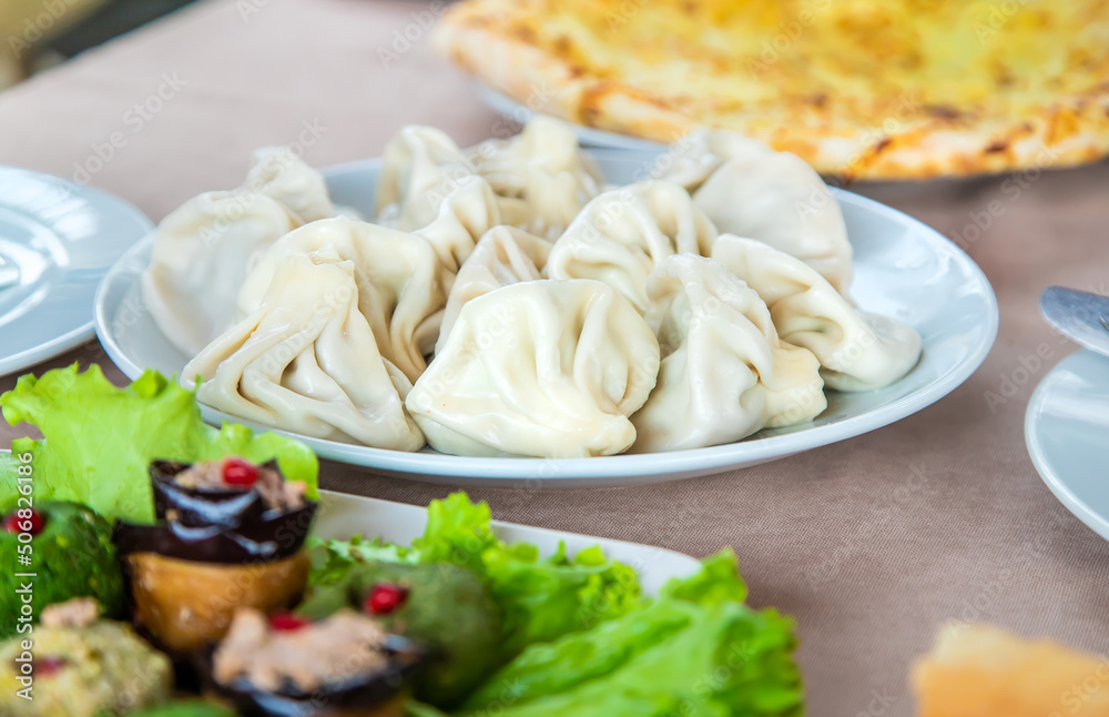 Georgian cuisine khinkali on the table. Selective focus. Georgian cuisine khinkali on the table. Selective focus.
