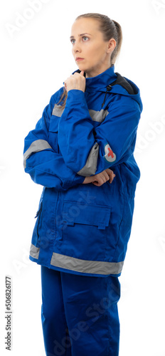 Paramedic, doctor, nurse folded her arms over her chest and looking at the camera. woman in a blue suit for the medic. isolated