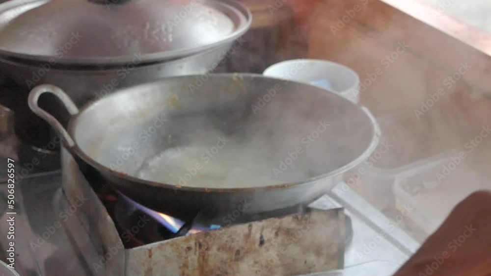 boiling water on a stove boiling water on a stove