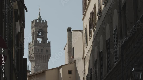 Arnolfo Tower saw trough Buldings in Florence - Lockdown in Florence photo