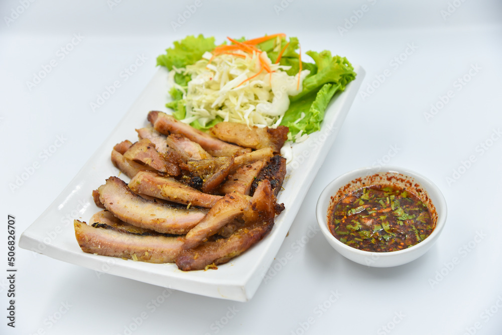 Deep-fried Pork Shoulder - Thai food, top view on white background. Deep-fried Pork Shoulder - Thai food, top view on white background.