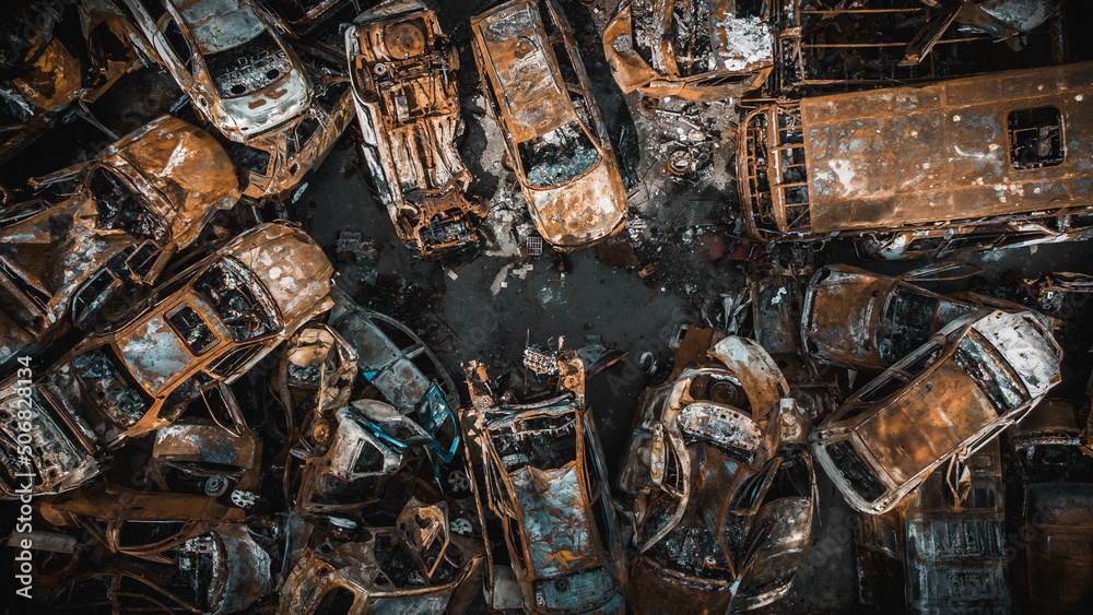 Irpin, Kyiv region, Ukraine - 19.05.2022 , a lot of burnt shelled cars in the parking lot, the consequences of the invasion of the Russian army in Ukraine. War in Ukraine. Drone photo