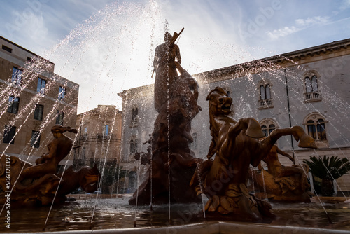 Close up view of historic baroque Fountain of Artemis on the Piazza Archimede in Ortigia, Syracuse (Siracusa), Sicily, Italy, Europe, EU. Diana fountain (Fontana di Diana). Detailed sculptures photo