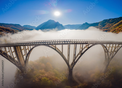 Montenegro. Dzhurdzhevich Bridge Over The River Tara foggy morning photo