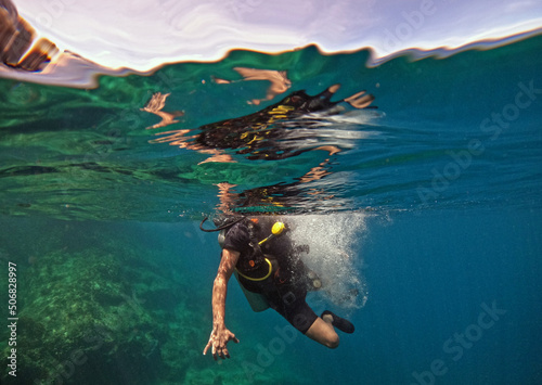 Scuba diver just underneath the ocean surface in Thailand