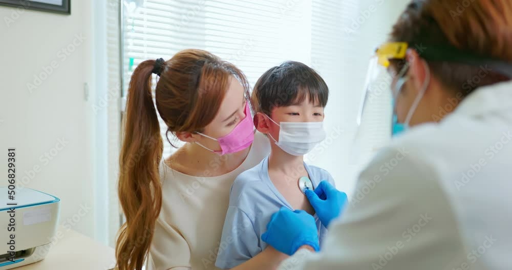 pediatrician examining sick boy pediatrician examining sick boy
