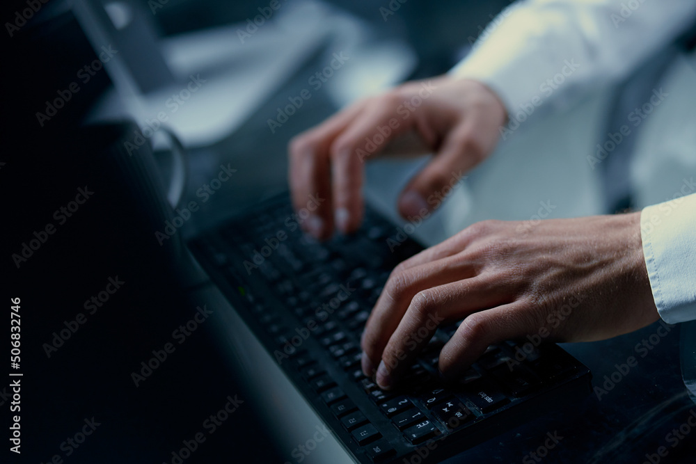 person typing text on a computer keyboard . person typing text on a computer keyboard .