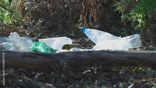 Pile of plastic bottles left in the woods. Nature polution  with plastic concept. Pile of plastic bottles left in the woods. Nature polution  with plastic concept. 