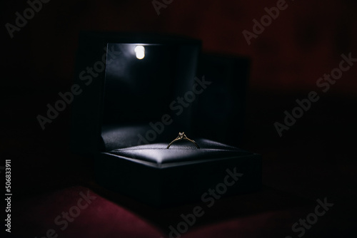 Opened box with a luxury white gold diamond engagement ring. © Bostan Natalia