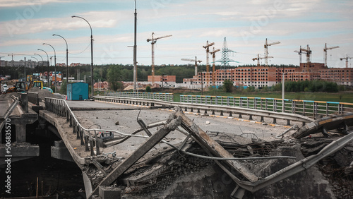 Irpin, Kyiv region,  Ukraine - 19.05.2022: Cities of Ukraine after the Russian occupation. destroyed bridge during the evacuation from the city of Irpin, northwest of Kyiv photo