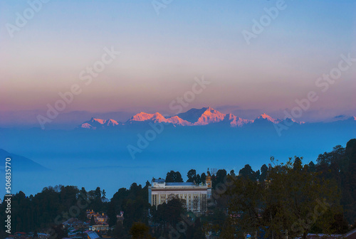 View of the city in the mountains against the backdrop of Kangchenjunga Mountain.