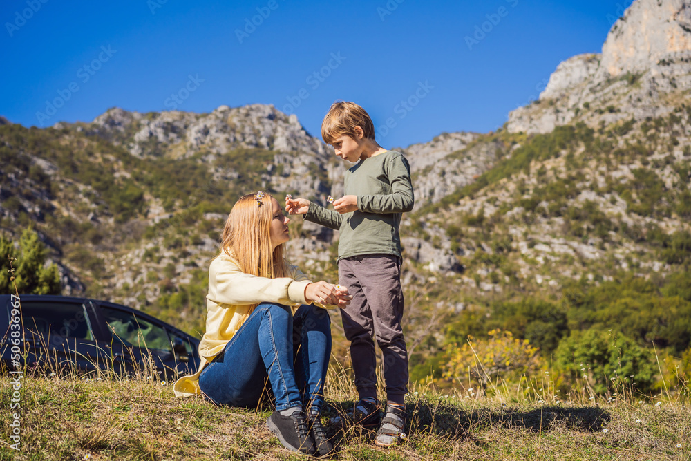 Montenegro. Mom and son tourists on the background of Clean clear turquoise water of river Moraca in green moraca canyon nature landscape. Travel around Montenegro concept