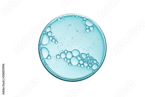 Abstract petri dish with cosmetic or medical liquid isolated on white background top view. Science cosmetic laboratory concept. photo