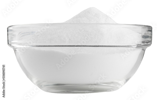 Soda in a glass bowl. Soda, flour, salt or sugar in a glass container, isolated on white background.