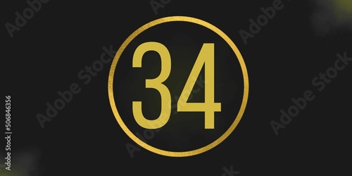 Number 34. Banner with the number thirty four on a black background and gold details with a circle gold in the middle photo