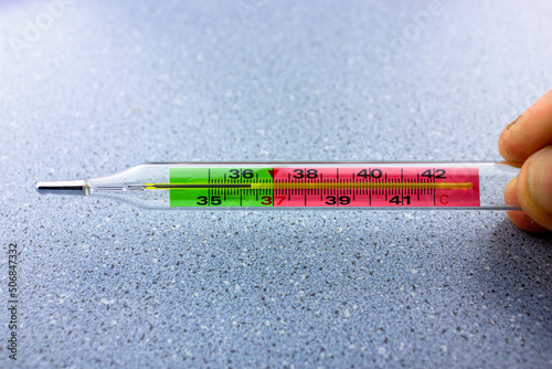 Thermometer for thermometry. Mercury thermometer.Glass thermometer close-up.Disease symptoms concept.