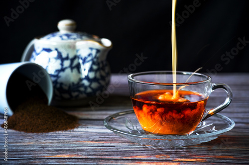 a cup of milktea and pouring milk