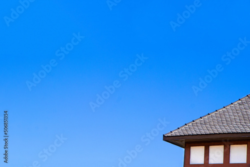 Oriental japan roof house on the blue sky.