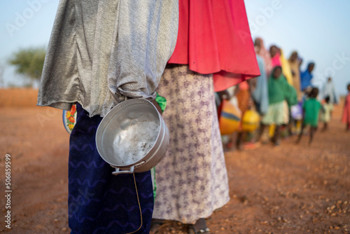 Fototapeta Food aid to needy and hungry people in Africa, social humanitarian aid, Ramadan