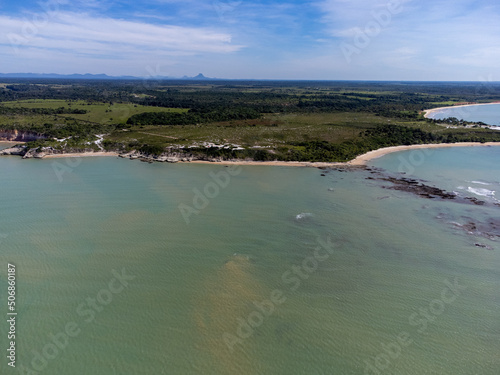 Amazing paradisiacal and deserted beach with clear blue waters and visible corals at low tide - Cumuruxatiba, Bahia, Brazil - aerial drone view © Rodrigo