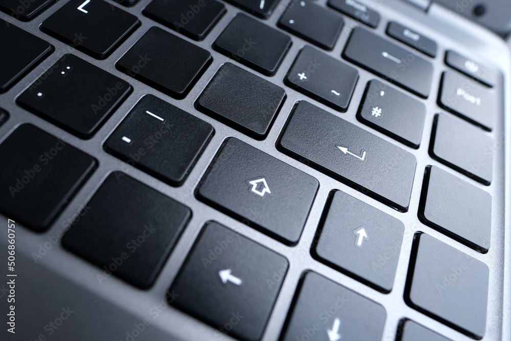 close-up part of a laptop, black keyboard of a laptop computer, buttons, concept of technology, working, learning from home in digital age, full-time teleworking close-up part of a laptop, black keyboard of a laptop computer, buttons, concept of technology, working, learning from home in digital age, full-time teleworking