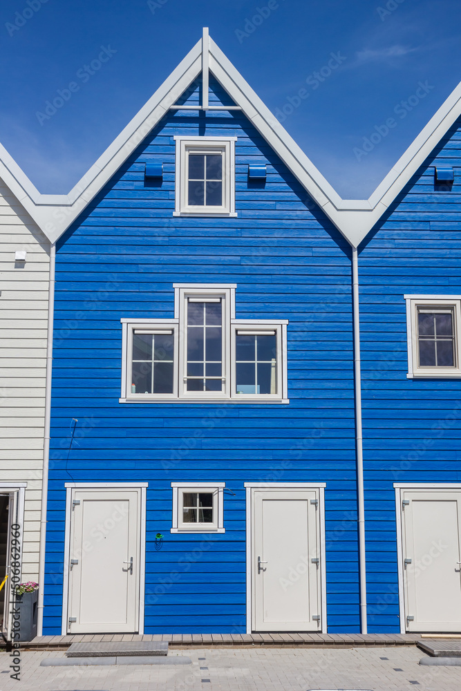 Bright blue wooden house in historic city Harderwijk, Netherlands