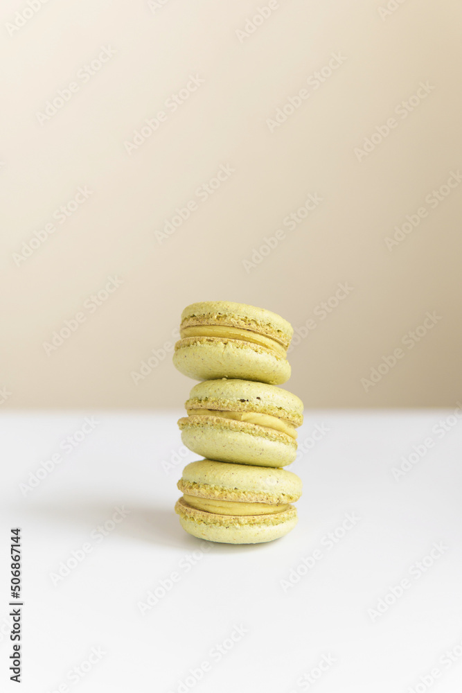 Pistachio macarons filling on top of each other Pistachio macarons filling on top of each other
