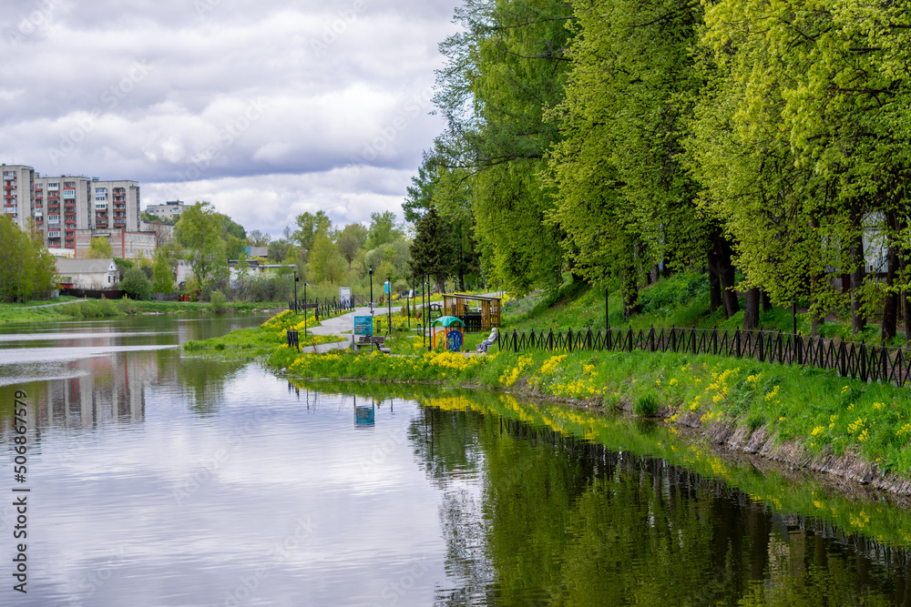 beautiful landscape of a lake with leafy trees and reflections in the water