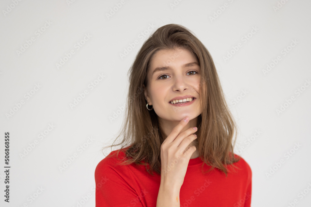 Candid portrait of young beautiful woman smiling happy at camera on white background. Candid portrait of young beautiful woman smiling happy at camera on white background.