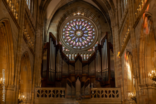 close-up horizontal plan of the organ next to the stained glass windows and columns of Bilbao Cathedral in Spain 