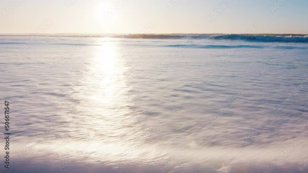 Beach in Brazil. Sandy beach with gentle foamy wave rolling over the coast at sunrise. Campeche town on the island of Santa Catarina in Brazil, Atlantic Ocean Beach in Brazil. Sandy beach with gentle foamy wave rolling over the coast at sunrise. Campeche town on the island of Santa Catarina in Brazil, Atlantic Ocean