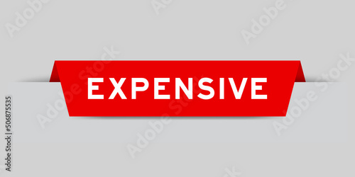 Red color inserted label with word expensive on gray background