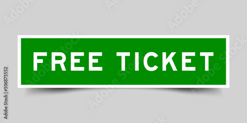 Sticker label with word free ticket in green color on gray background