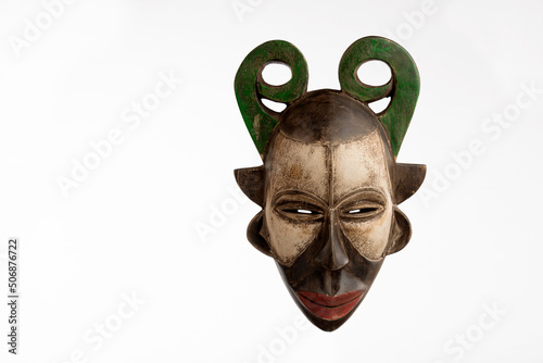 African mask from Gabon on a white background photo