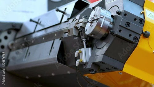 Wire bending machine. CNC metal processing. Automated metalworking machine.