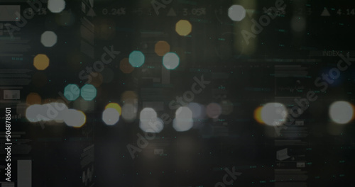 Image of statistics and financial data processing over out of focus city road lights