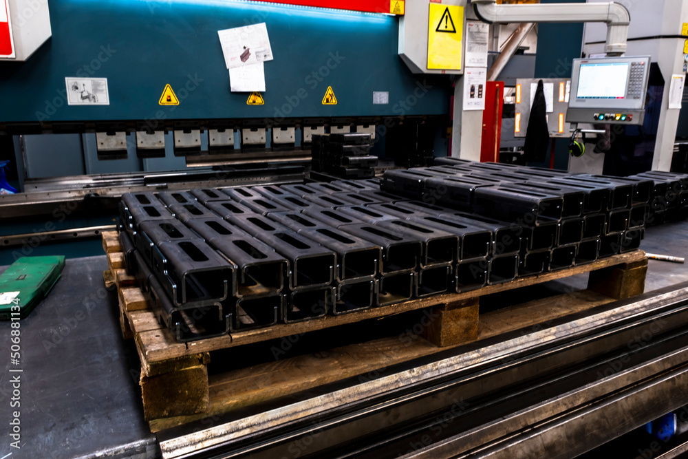 Special steel profile prepared in CNC machine stands in a heap. Selective focus profiles. Special steel profile prepared in CNC machine stands in a heap. Selective focus profiles.