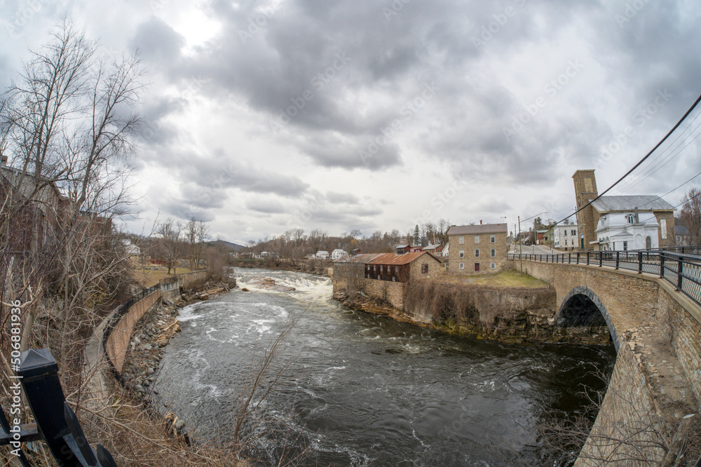Ausable River seen from Stone Arch Bridge in Keeseville New-York state in springtime