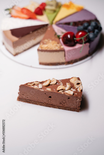 Piece of cake with chocolate and nuts. Sweet dessert.