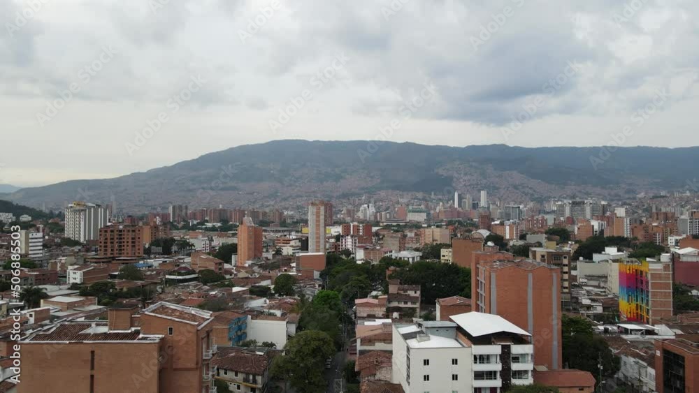 Flying over tree lined street in a large city, Medellin, Colombia Flying over tree lined street in a large city, Medellin, Colombia