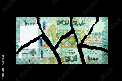 Ripped one thousand Lebanese pounds bill, currency of Lebanon photo