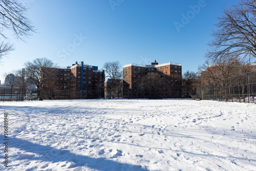 Snow Covered Park next to Public Housing in Astoria Queens New York during the Winter