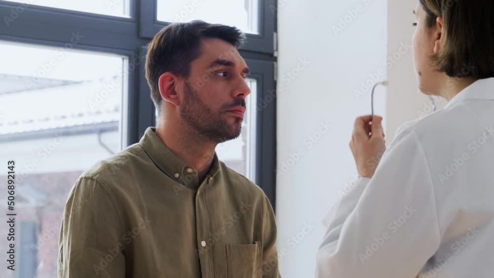 medicine, healthcare and people concept - female doctor with stethoscope and male patient at hospital medicine, healthcare and people concept - female doctor with stethoscope and male patient at hospital