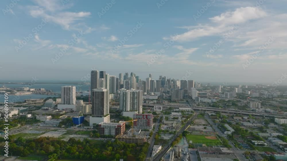 Aerial panoramic view of large city. Group of contemporary tall buildings on waterfront at twilight. Miami, USA Aerial panoramic view of large city. Group of contemporary tall buildings on waterfront at twilight. Miami, USA