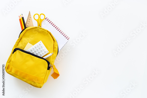 Yellow school backpack. Back to school concept. Top view