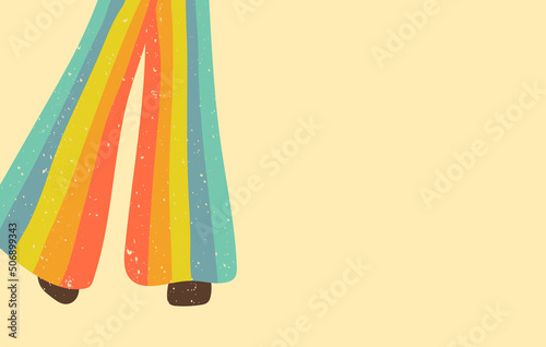Rainbow striped flared jeans on female legs standing posture. Vintage copy space background.