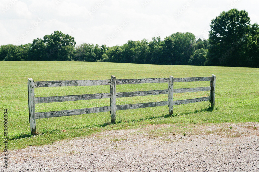 white fence in a field