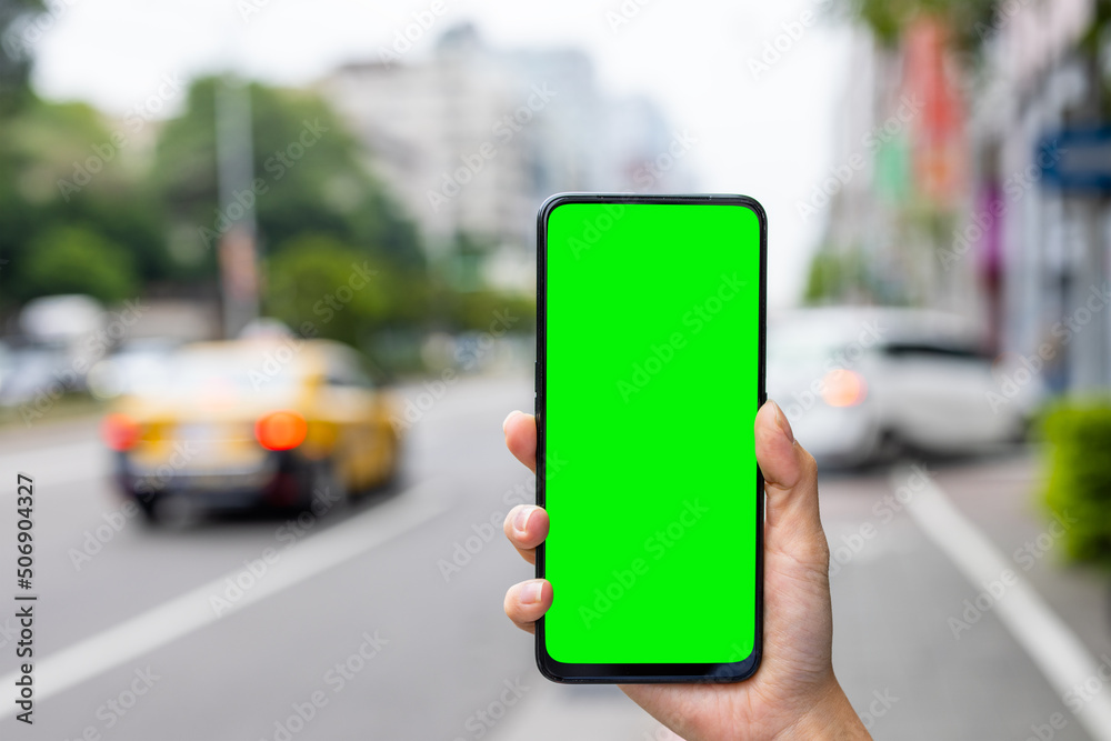 Green screen on mobile phone in the street