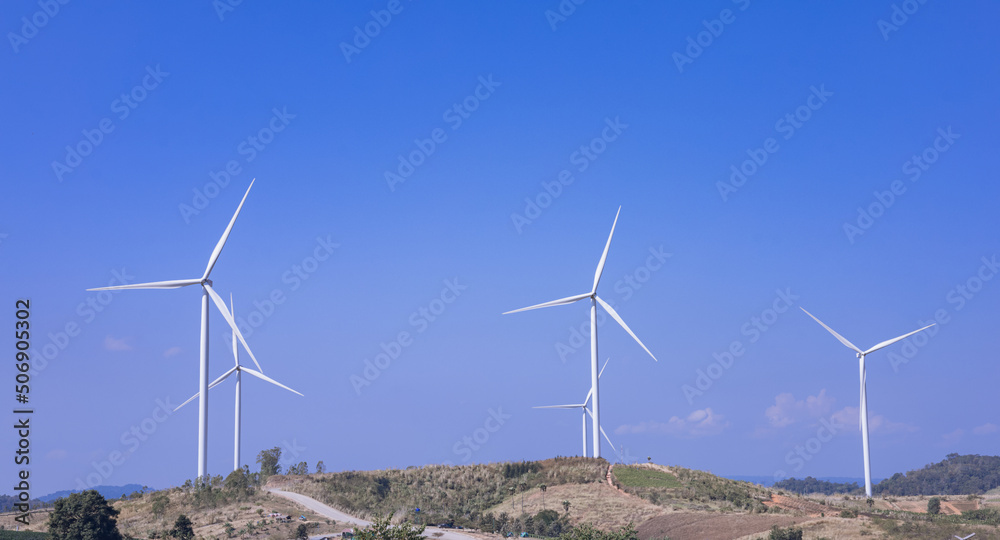 Offshore wind power and energy farm with many wind turbines on the mountain Offshore wind power and energy farm with many wind turbines on the mountain